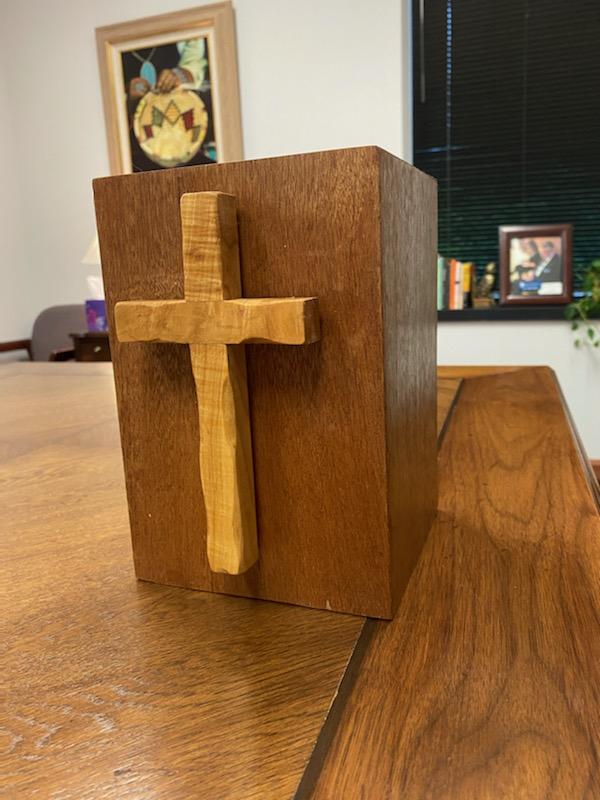 Hardwood urn with a raised wooden cross